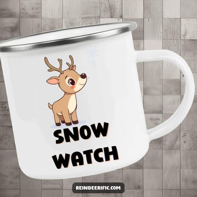 Funny enamel camping mug with a curious reindeer tilting its head to observe a falling snowflake.